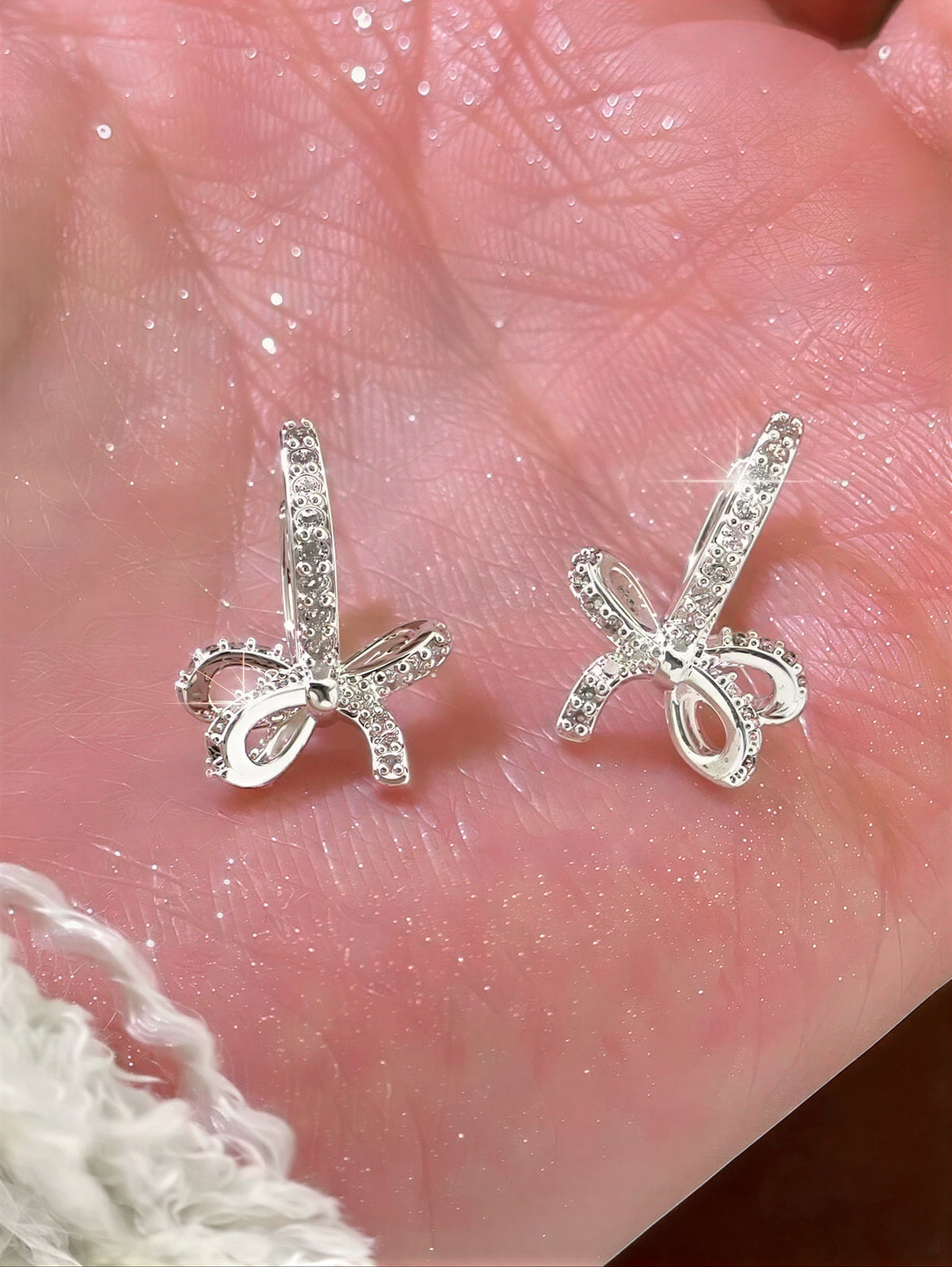 【S999純銀ポスト】キュービックジルコニアきらめく上品なリボンピアス