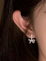 【S999純銀ポスト】キュービックジルコニアきらめく上品なリボンピアス